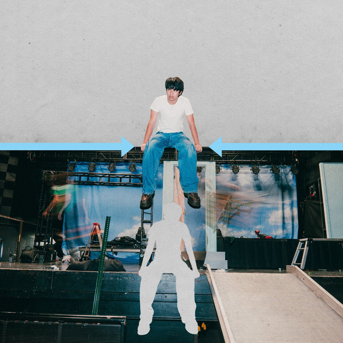 MICO sitting on a blue line above the stage